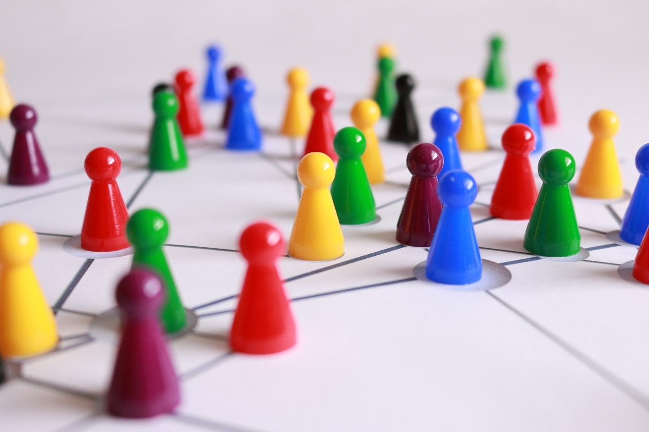 Colorful board game pieces aligned in network arrangements.