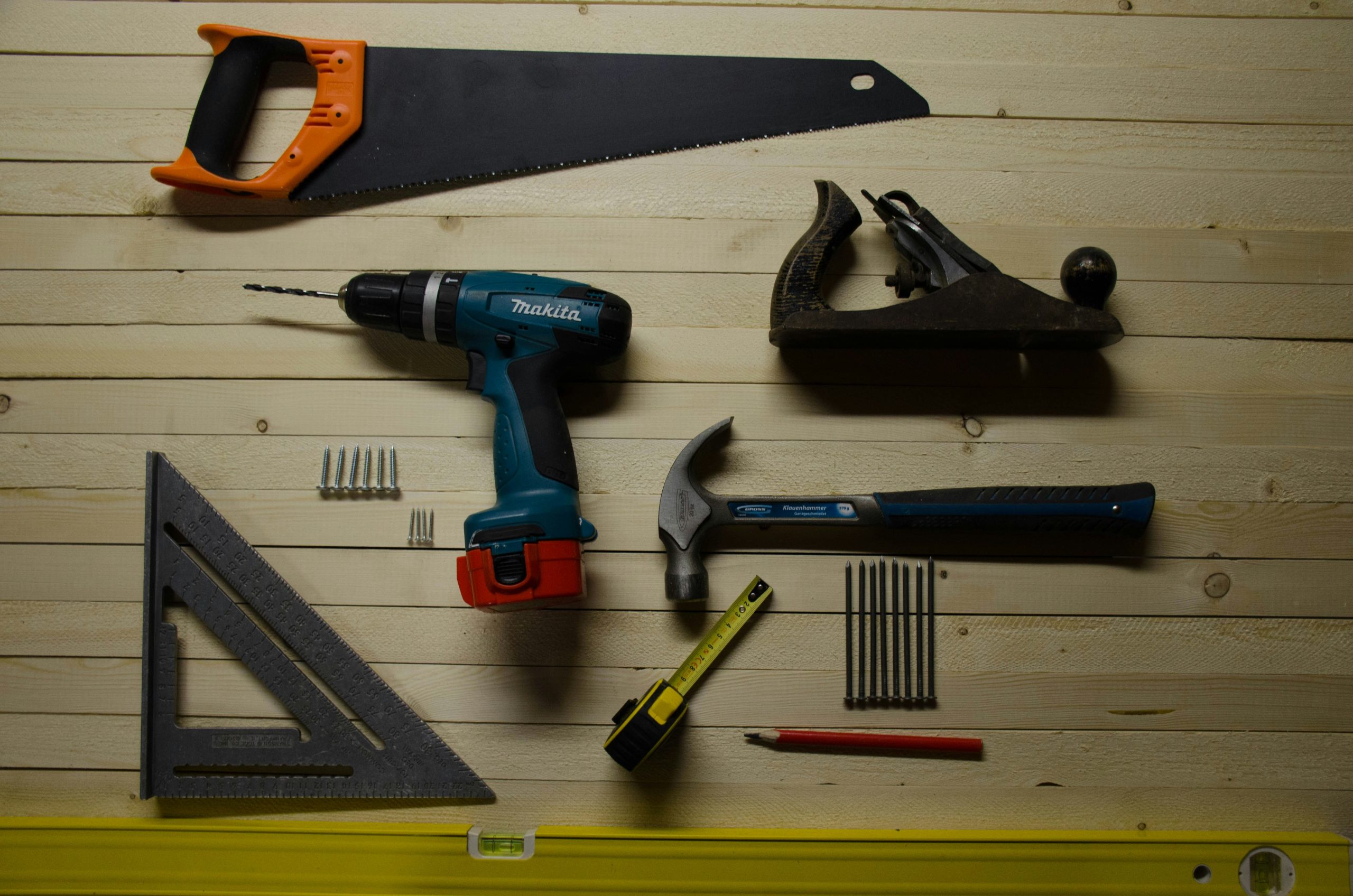 Various hand tools arranged on a table